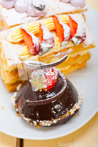 Image of selection of fresh cream cake dessert plate