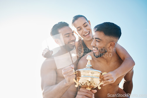 Image of Celebration, winner and happy volleyball team on the beach with a trophy for goals, success or achievement. Winning, celebrate and group of athletes together by ocean or sea on a summer weekend trip.