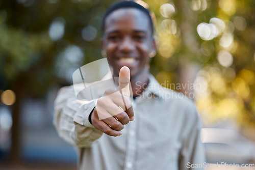 Image of Black man, hands and thumbs up in park for good job, approval or success in the nature outdoors. Portrait of happy African male person show thumb emoji, yes sign or like for agreement or deal outside