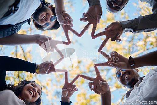 Image of Creative people, hands and star with fingers in teamwork, solidarity or collaboration in nature. Low angle of team group touching hand together for faith, support or community, hope or startup goals