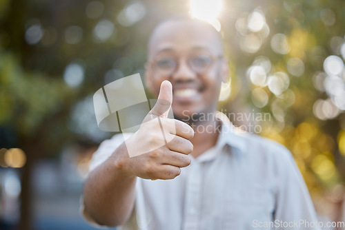 Image of Black man, hands and thumbs up in park for success, good job or approval in the nature outdoors. Portrait of happy African male person show thumb emoji, yes sign or like for agreement or deal outside