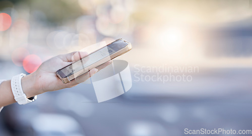 Image of Woman, hands and phone in the city for communication, networking or social media in street. Hand of female person in road on mobile smartphone for online browsing, texting or chatting in a urban town