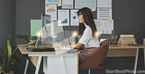 Image of Woman, analytics and data analyst working from home, computer and employee at desk with graph and charts. Information, statistics and female person typing, remote work and review online research