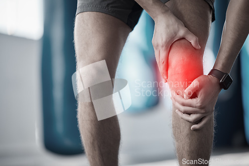 Image of Fitness, closeup and man with a knee injury, accident or pain after a exercise in the gym. Sports, medical emergency and zoom of a male athlete with bruise or sprain leg muscle or bone after workout.