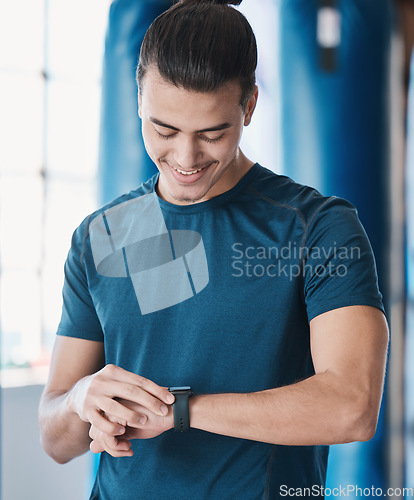 Image of Man, fitness and smart watch with app to check, measure or time exercise for tracking health on technology. Sports, athlete and happy with workout, training and cardio wellness in gym facility
