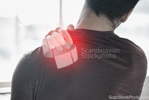 Image of Hand, back pain and injury with the shoulder of a man in red highlight during a fitness workout. Healthcare, anatomy and emergency with a male athlete holding a joint after an accident in the gym