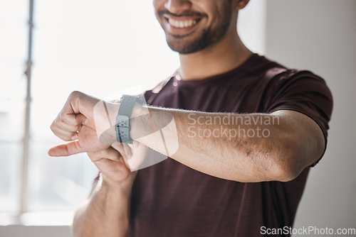 Image of Athlete, fitness and smart watch with app to check, measure or time exercise for tracking health on technology. Sports, man and happy with workout, training and cardio wellness in gym facility