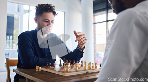 Image of Board game, chess and men playing at a table while talking strategy or plan. Business partners or friends together to play, relax and bond with wooden icon for problem solving, challenge or checkmate