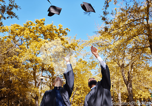 Image of Graduation cap, students or friends and throw in air or sky for celebration, study success and achievement on campus. University people or graduate with college, school and education or scholarship