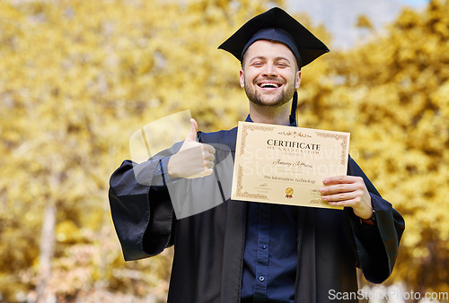 Image of Graduation portrait, certificate and student thumbs up for university, education or college success on campus or park. Excited man or graduate like, yes or excellence emoji and sign, diploma or award