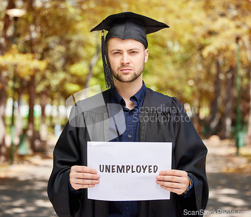 Image of Portrait, graduation and unemployment with a student man holding a sign outdoor for debt, loans or jobless. Economy, future and depression with an unhappy college pupil during a labor crisis