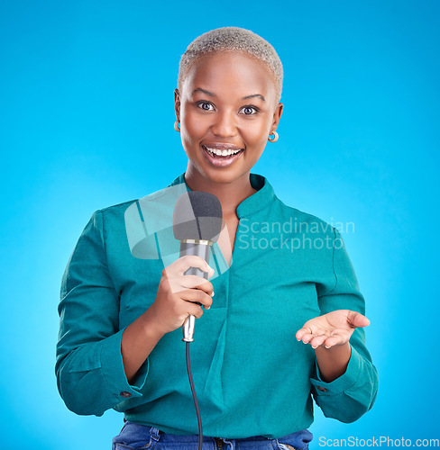 Image of Woman, microphone and studio portrait for interview, news program or questions for talk show by blue background. Young African reporter, journalist or happy tv host with holding mic, speech and press