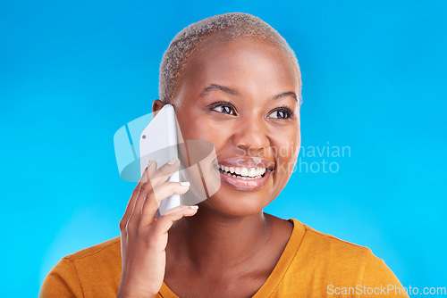 Image of Phone call communication, face and happy black woman speaking in conversation, consulting or chat discussion. Cellphone user, studio smile and talking African person listening on blue background