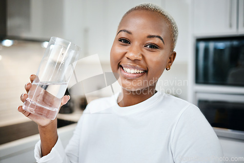 Image of Portrait, glass and black woman drinking water, wellness and health with nutrition, funny or happiness. Face, female person or girl in her kitchen, liquid for energy or home with aqua, detox or smile