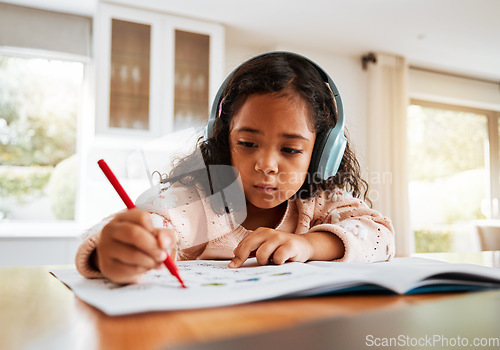 Image of Education, learning or headphones on kid for homework, writing and drawing books for homeschooling. Childhood development, focus and young girl listening to music while studying for kindergarten test