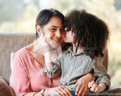 Image of Kiss, family and grandmother with child on a sofa happy, sweet and bond in their home. Love, kissing and senior woman with girl kid in living room hug, having fun and enjoying weekend together