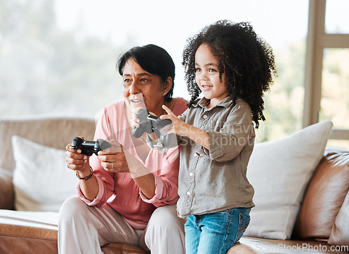 Image of Grandmother, kid and gaming on sofa, controller and happy together with bond, care and love in family home. Senior woman, young child and playing with video game, esports and excited in living room