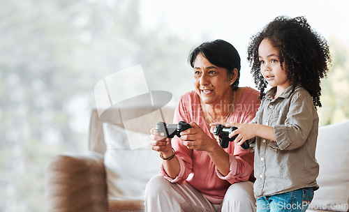 Image of Grandma, child and gaming in home, controller and happy together with bonding, competition and love in lounge. Senior woman, young kid and playing with video game, esports and mockup in family house