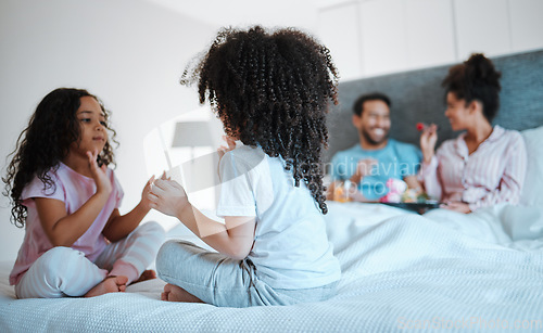 Image of Happy, breakfast and relax with family in bedroom for morning, love and care. Happiness, support and free time with parents and children in bed at home for wake up, bonding and peace together