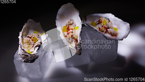 Image of Fresh Oyster salad on the half shells.