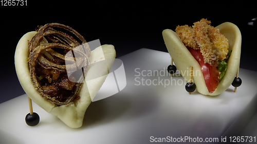 Image of Two spicy taco with shrimp and beef with fried onion