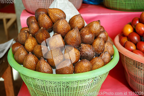 Image of Salak Bali or Snake fruit in plastic basket
