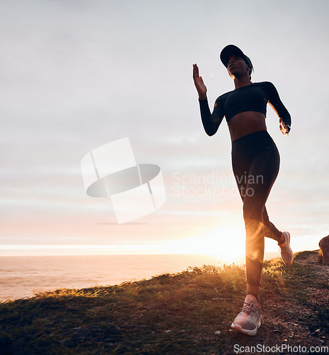 Image of Running, sunrise and woman on mountain by ocean for exercise, marathon training and fitness. Sports, mockup space and female person in nature for warm up, cardio workout and body wellness in morning