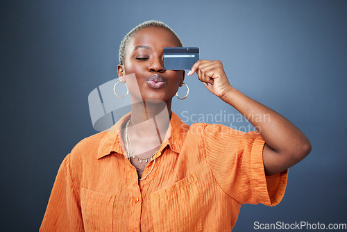 Image of Shopping, credit card and black woman in studio for banking, savings and budget on grey background. Investment, cashback and African female satisfied with membership, payment or customer experience