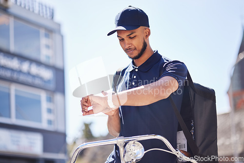 Image of Courier, city and man check time for package, parcel and customer order delivery on bicycle. Ecommerce, logistics and male person on bike with wrist watch for travel, transport and shipping service