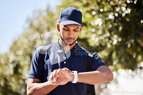 Image of Courier, city and man check watch for package, parcel and customer order delivery in urban town. Ecommerce, logistics and male person with time management for travel, transport and shipping service