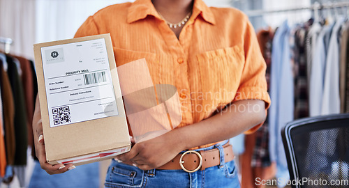 Image of Hands, designer or woman with box for delivery, shipping or package with logistics in ecommerce in office. Closeup, fashion or business owner with clothes stock or store order for courier service