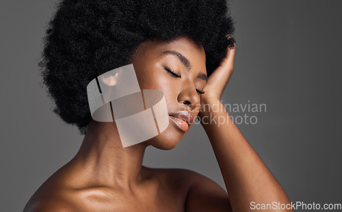 Image of Natural beauty, hair care and black woman with skincare, dermatology and confident girl on a grey studio background. Female person, luxury or model with makeup, cosmetics and aesthetics with grooming