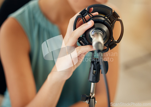 Image of Microphone, hand and woman on podcast or live stream, closeup media broadcast for web radio host. Streaming, influencer or content creator with mic, internet recording and networking in home studio.