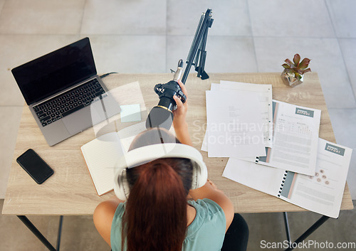 Image of Microphone, laptop and woman on podcast from above for live stream, media broadcast or webinar. Streaming, influencer or content creator with mic, elearning and networking online class in home office