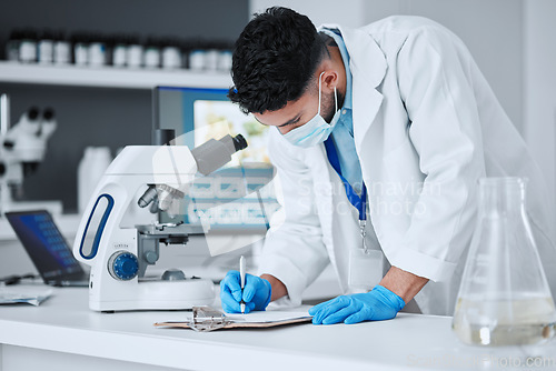 Image of Research, writing and science with man in laboratory for report, pharmacy and medical. Checklist, healthcare and medicine with scientist and clipboard for data chart, vaccine development and study