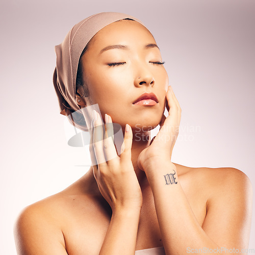 Image of Asian woman, beauty and skincare in studio for makeup, glow, soft touch and cosmetic results by background. Japanese model, girl and eyes closed for wellness, aesthetic and change for skin health