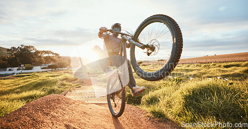 Image of Sports, adrenaline and man of bicycle in nature for training, workout and exercise in countryside. Fitness, cycling and male person with mountain bike for adventure, freedom and speed on dirt road