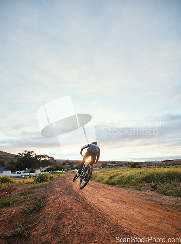 Image of Sports, cycling and man on mountain bike in nature for training, workout and exercise in countryside. Fitness, cyclist and person with bicycle for adventure, freedom and adrenaline on dirt road