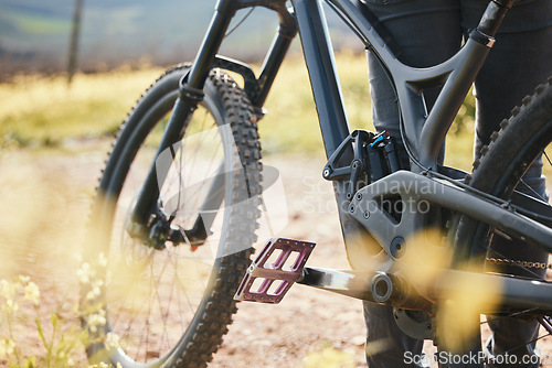 Image of Sports, cycling and closeup of bicycle in nature for training, workout and exercise in countryside. Fitness, cyclist and person with mountain bike for adventure, freedom and ride on outdoor dirt road