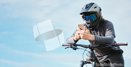 Image of Phone, mockup and cyclist on a bicycle typing social media, online or internet for bike extreme sports communication. Outdoor, fitness and biker or person texting or search the web or website