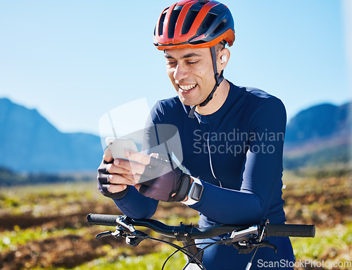 Image of Cycling, break or happy man with phone on social media for sports, training or fitness workout content. Smile, bicycle or male cyclist resting with mobile app for networking, browsing or searching