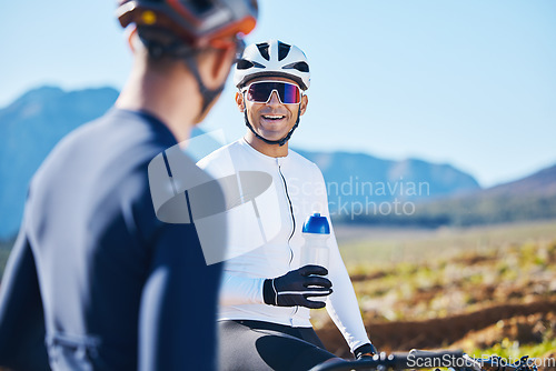 Image of Fitness, bike and water with friends in nature for cycling, taking a break from their cardio or endurance workout. Exercise, mountain and a man cyclist team outdoor to relax during sports training