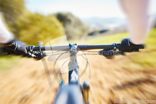 Image of Fitness, cycling and person pov on bike in nature for extreme sports, race or training with motion blur. Bicycle, exercise and cyclist riding on dirt road with energy, adrenaline or speed challenge