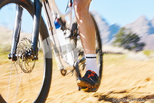 Image of Closeup, outdoor and biker with fitness, speed and training with performance, challenge and progress. Zoom, male person and cyclist with workout goal, nature or travel with sports, fast and target