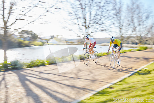 Image of Fitness, team or men cycling on bicycle for training, cardio workout or race exercise in park together. Fast speed, healthy friends or sports athletes riding bike on road or path for a fun challenge