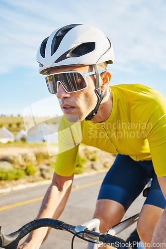 Image of Cycling, sports and man on a bike in road for fitness, training and morning cardio routine in nature. Bicycle, exercise and male cyclist riding outdoor for practice, freedom or performance challenge