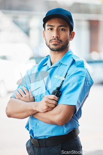 Image of Security guard, safety officer and portrait of a man on street for protection, patrol or watch. Law enforcement, serious and walkie talkie of a crime prevention male worker in uniform outdoor in city