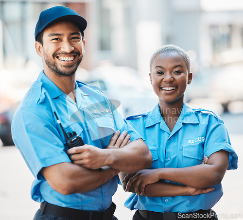 Image of Security guard, safety officer and team portrait on the street for protection, patrol or watch. Law enforcement, happy and smile of crime prevention man and black woman in uniform outdoor in the city