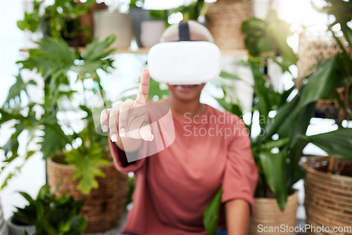 Image of Woman, virtual reality and headset with a finger at home for metaverse, 3d world or future. Female person with plants and vr glasses for ecology, ai or hand for interaction, video game or experience