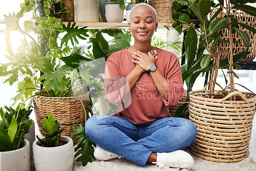 Image of Peace, breathe and calm woman by plants for meditation exercise in a greenery nursery. Health, gratitude and young African female person with a relaxing zen mindset by an indoor greenhouse garden.